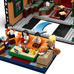 Vibrant LEGO coffee shop scene with colorful characters enjoying drinks and conversation around a table.