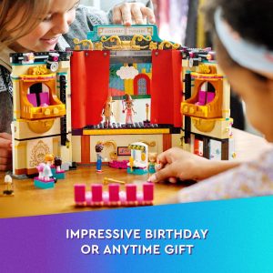 Children enjoy creative play with a colorful LEGO theater set, sparking imagination and collaboration.