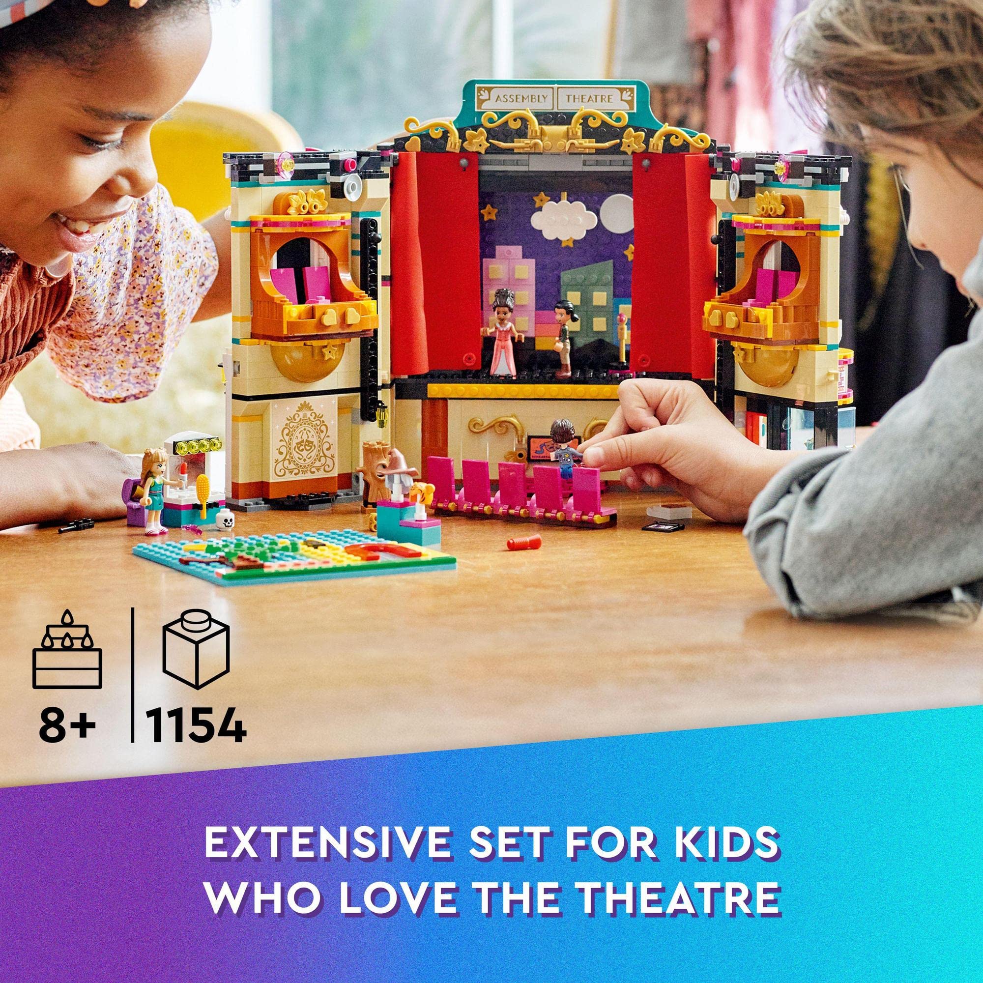 Two girls create stories together with a vibrant Lego theater playset for imaginative fun.