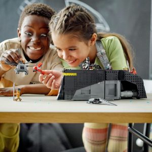 Children joyfully build a LEGO battleground, showcasing creativity and teamwork in imaginative play.