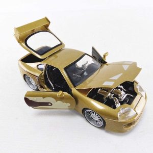 Stunning gold sports car model with detailed interior and engine, showcasing automotive craftsmanship.