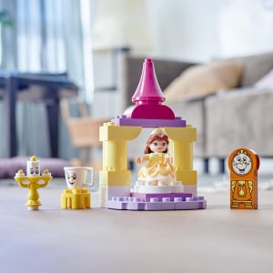 Colorful LEGO princess tower with accessories, featuring a princess, candelabra, and clock.