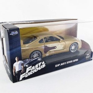 Gold Slap Jacks Toyota Supra collectible from Fast & Furious, displayed in a clear case.