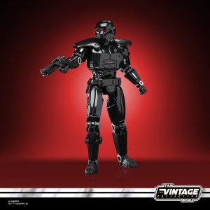Star Wars vintage action figure in black armor against red background, perfect for collectors.