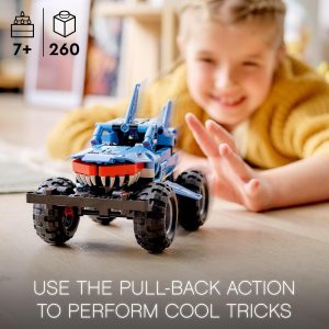 Joyful child playing with a vibrant blue pull-back action car in a cozy living space.