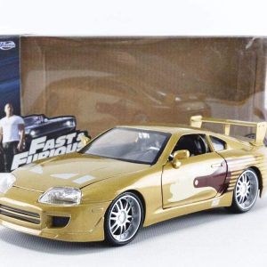 Gold Toyota Supra die-cast model, Fast & Furious collectible, perfect for car enthusiasts and fans.