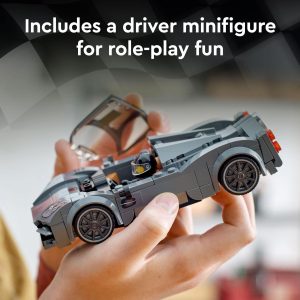 Detailed gray car model with racing driver minifigure in a cozy play setting.