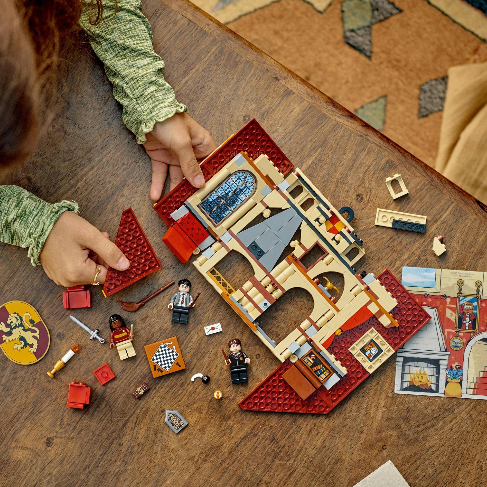 Child builds a colorful LEGO medieval castle, sparking imaginative adventures with knights and accessories.