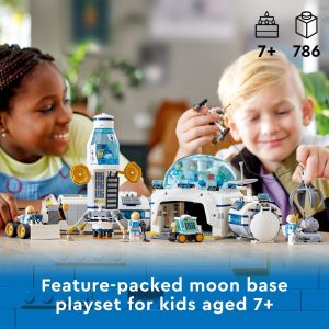 Children joyfully explore a detailed moon base playset, sparking creativity and imagination indoors.