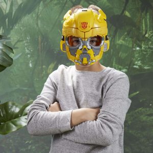 Confident child in Bumblebee mask explores a vibrant jungle, embracing imaginative adventure.