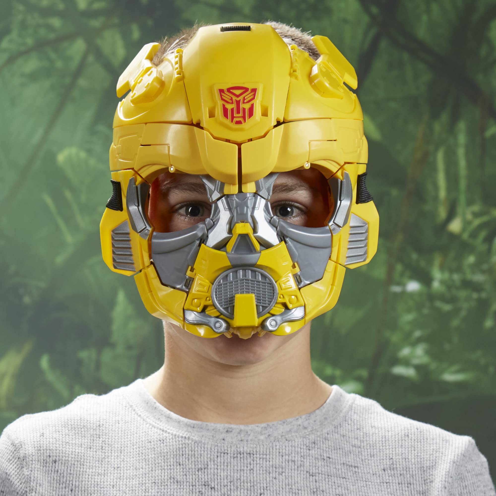 Child wearing Bumblebee helmet in a vibrant outdoor setting, embodying playful imagination and joy.