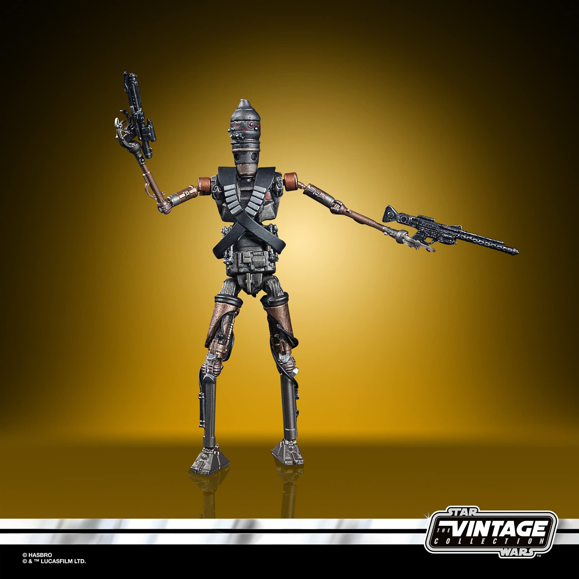 Star Wars Vintage droid action figure in dynamic pose against a vibrant golden background.