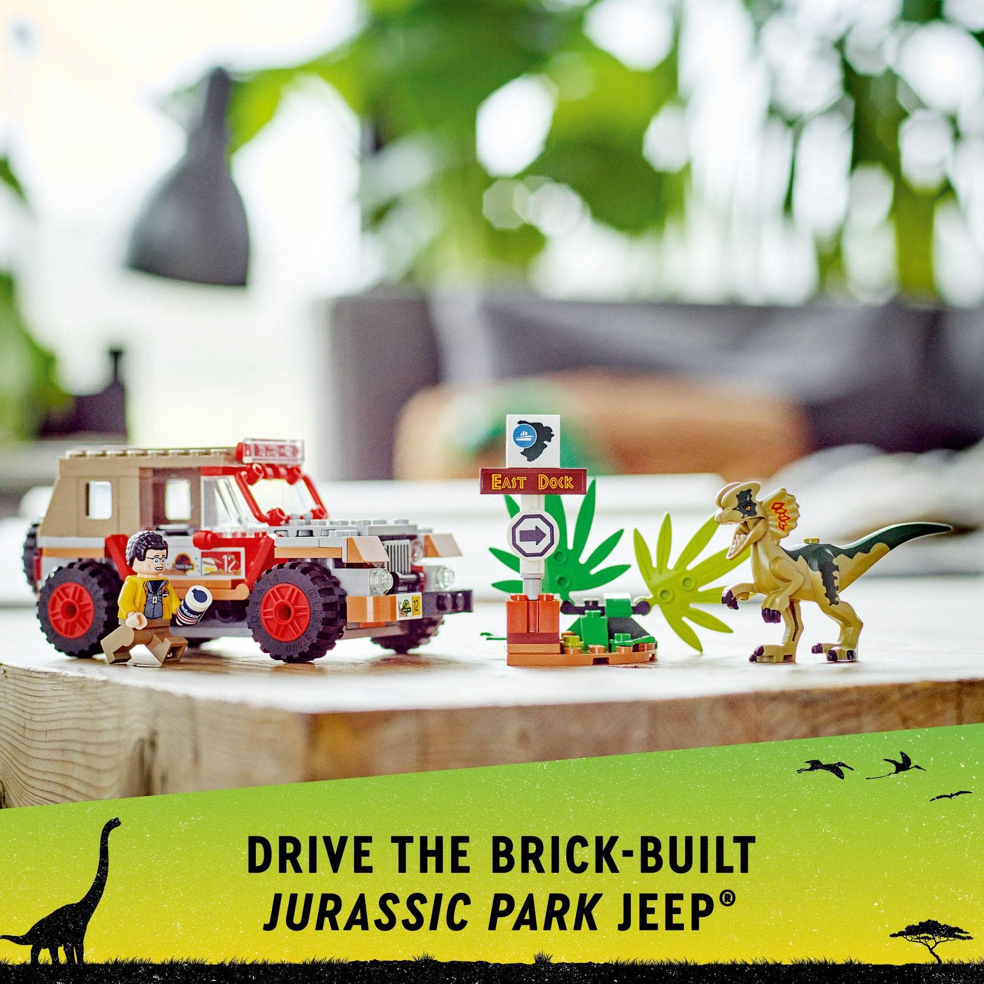 Colorful LEGO Jurassic Park jeep set with dinosaur scene and vibrant greenery for imaginative play.