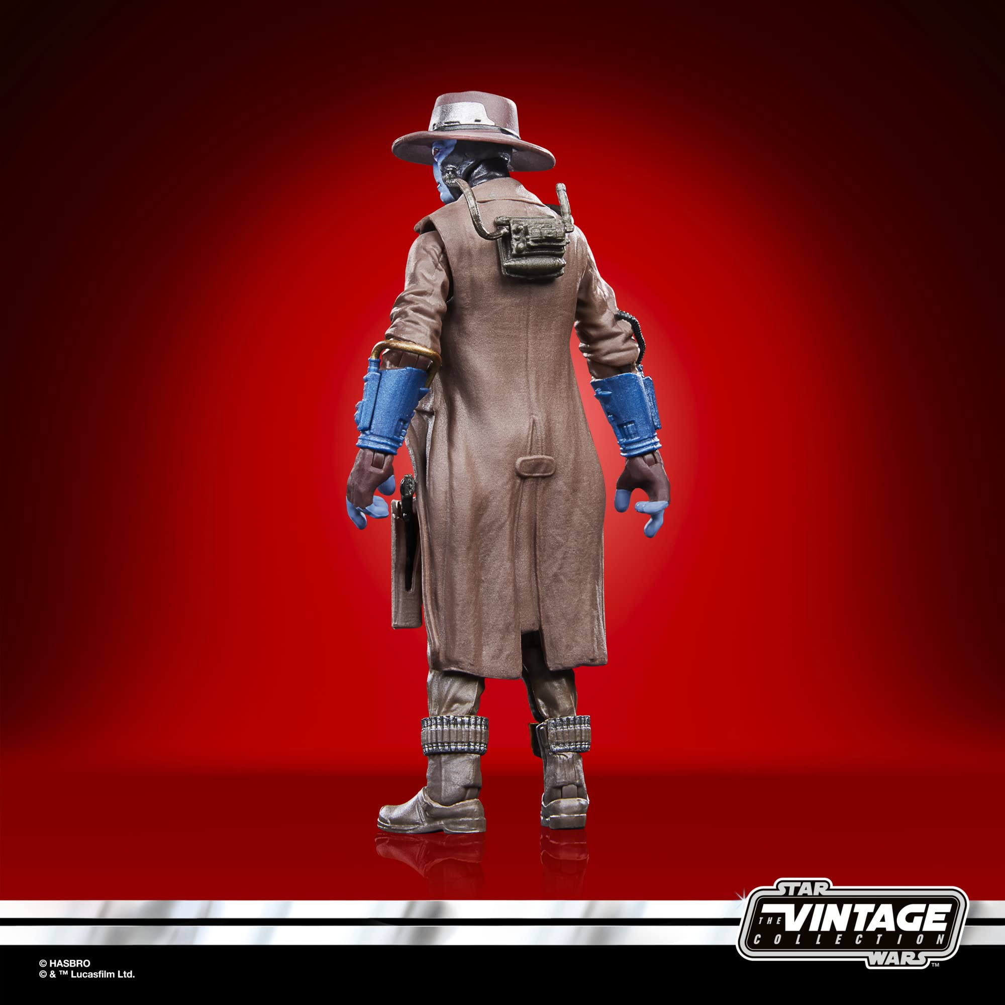 Enigmatic sci-fi action figure in trench coat, blue accents, Vintage Collection, bold red background.