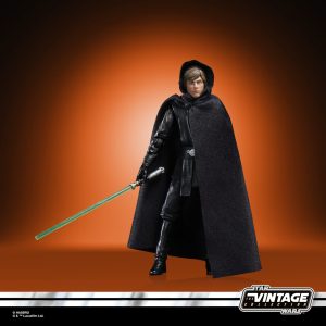 Star Wars Vintage Collection action figure with lightsaber, intricately designed against a warm orange backdrop.
