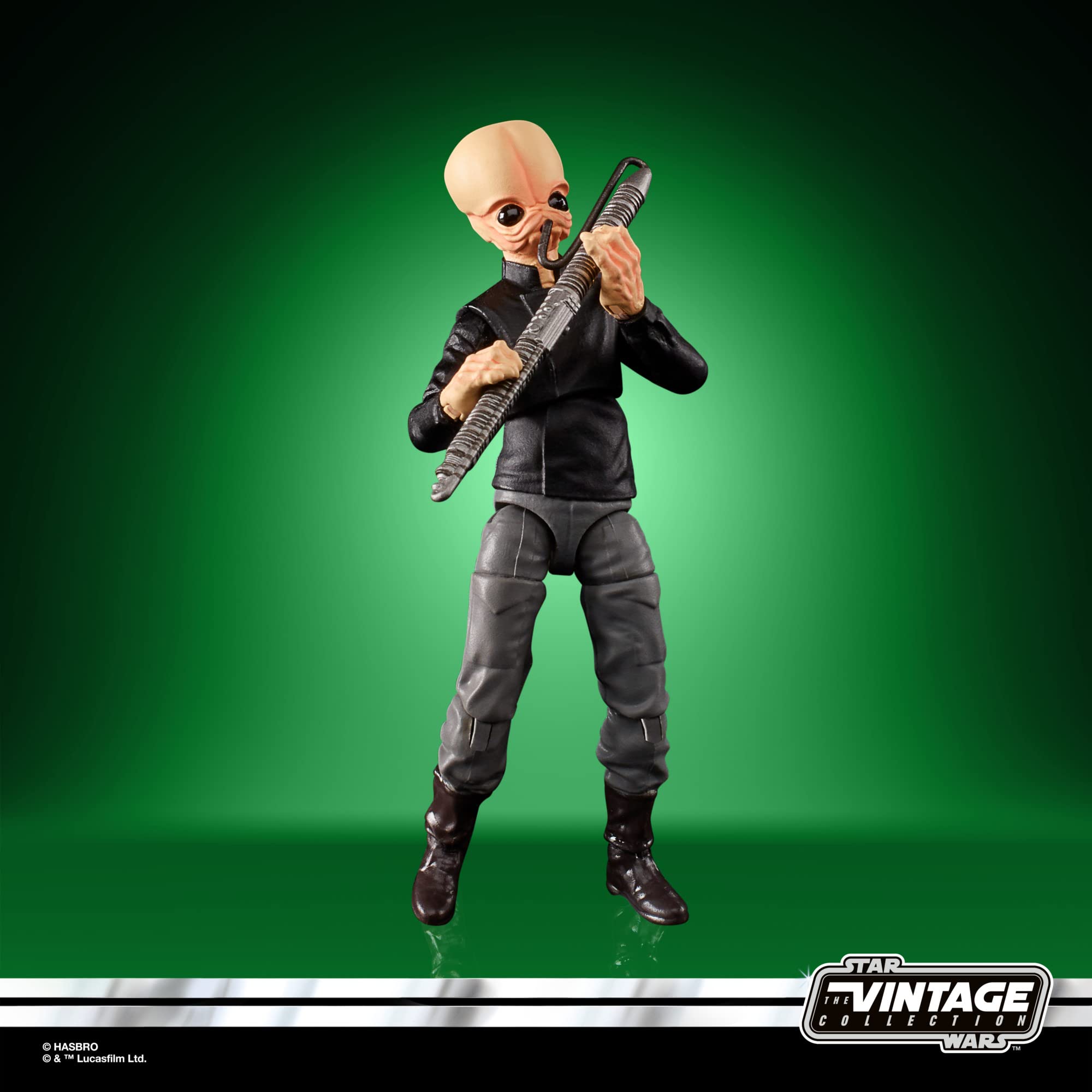 Dynamic Star Wars alien action figure in black outfit, wielding staff against vibrant green backdrop.