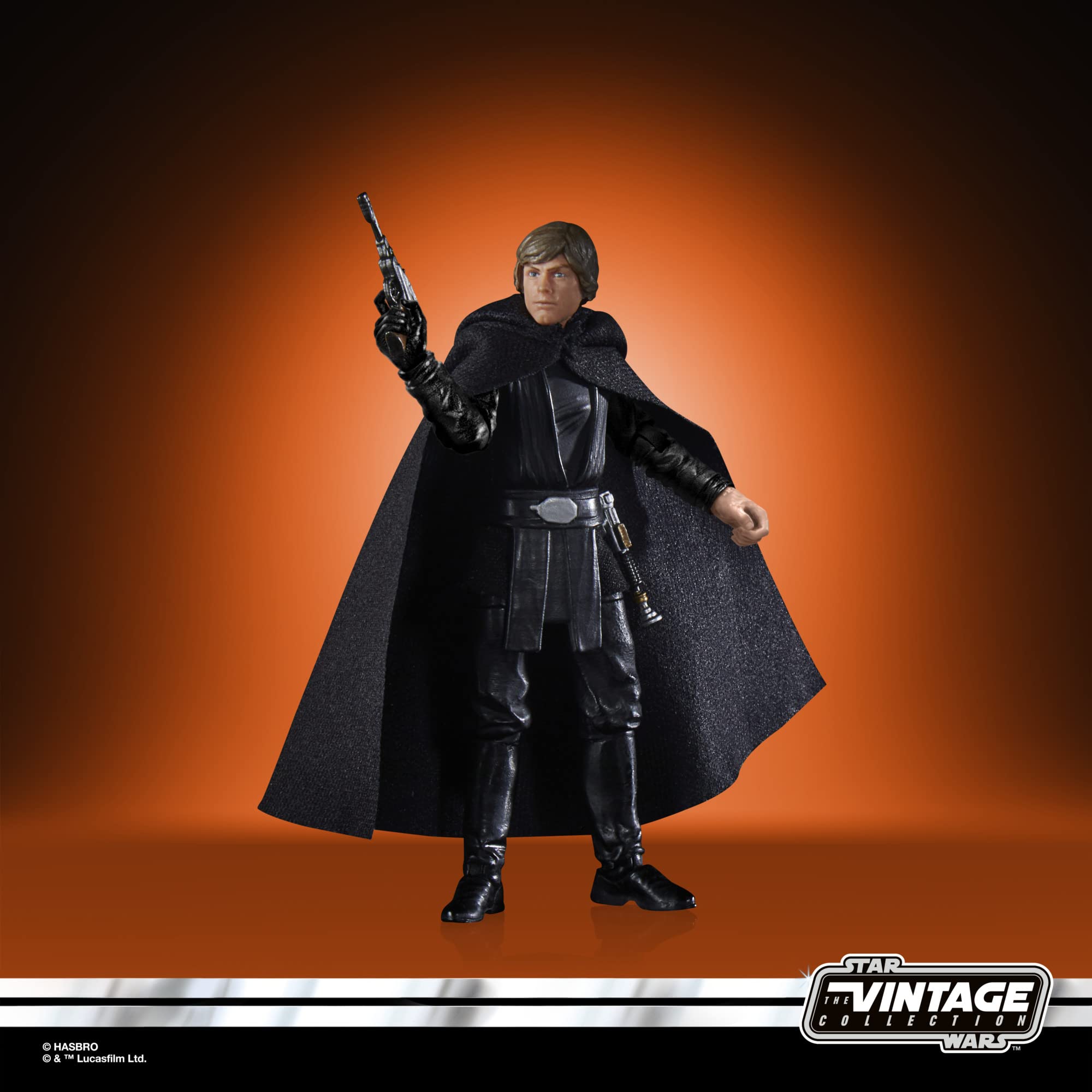 Star Wars action figure in black suit, cape, and blaster against vibrant orange background.