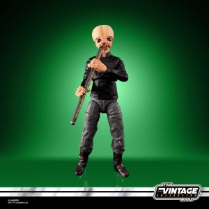 Vintage Star Wars action figure with a whimsical alien playing a flute against a vibrant background.