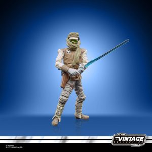 Star Wars Vintage action figure with detailed helmet and blue lightsaber in dynamic pose.