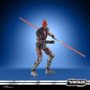 Sith action figure with crimson lightsaber from Star Wars Vintage Collection, against a blue gradient.