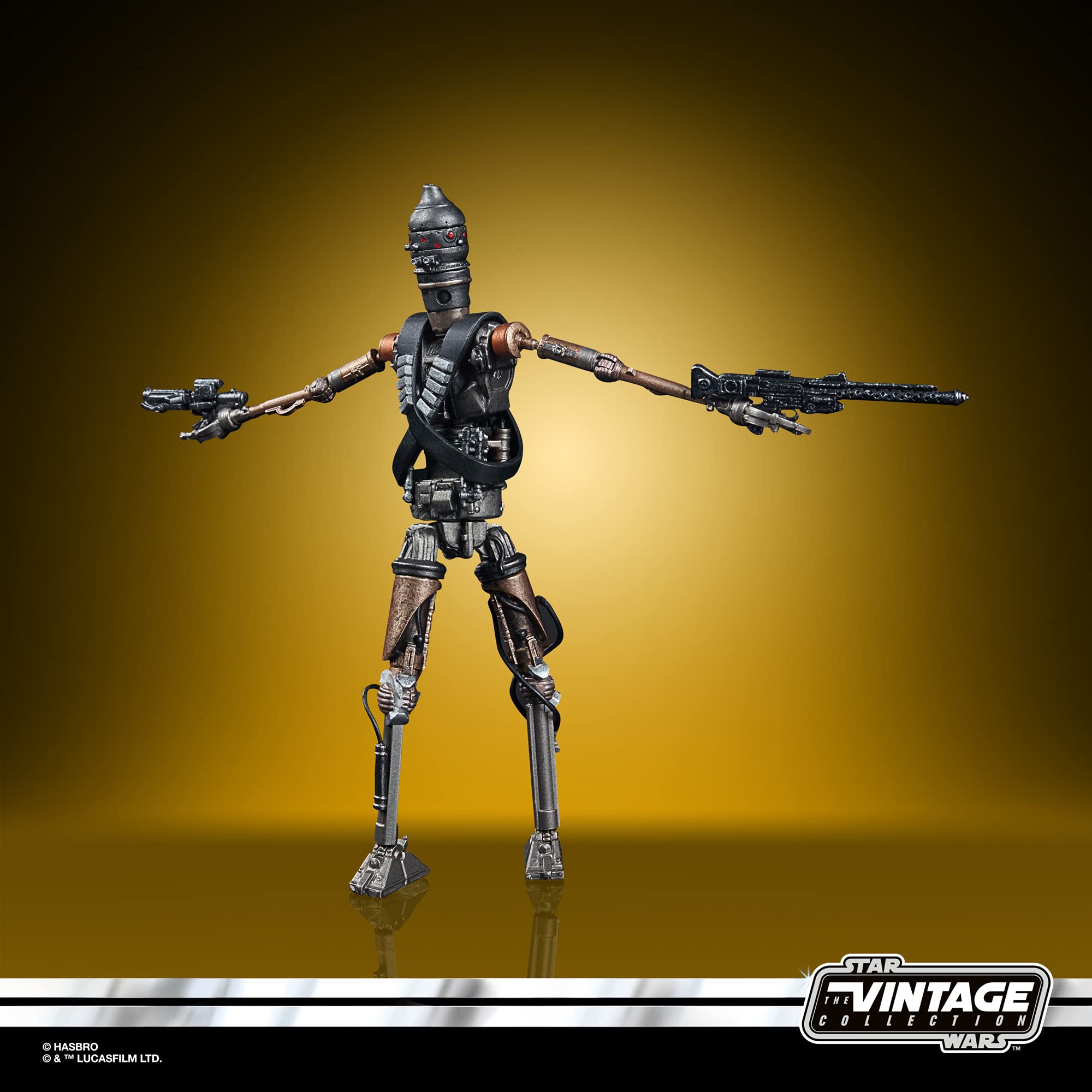 Vintage Star Wars droid action figure in dynamic pose, featuring detailed metallic design and accessories.