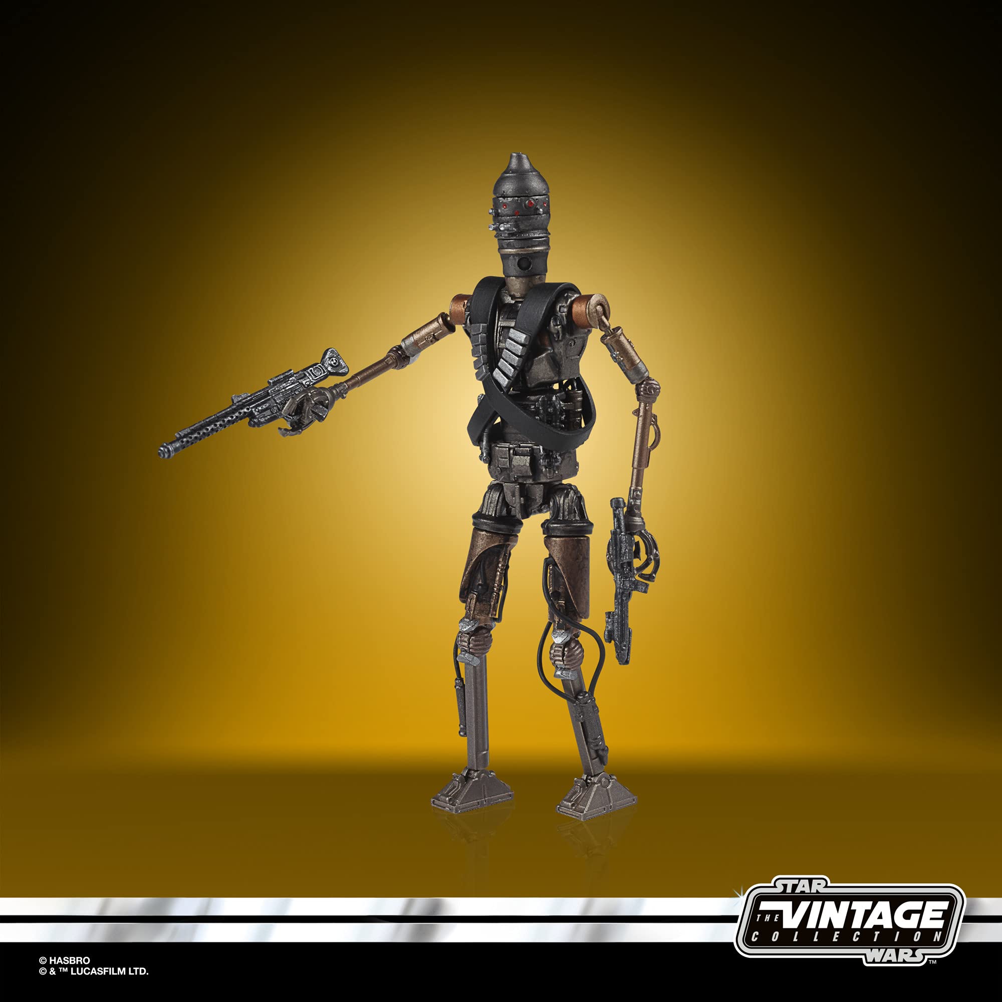 Vintage Star Wars robotic action figure with blaster, showcasing intricate details and dynamic pose.