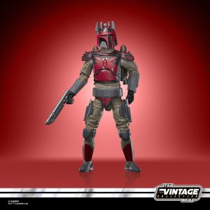 Vintage Star Wars bounty hunter action figure in detailed armor with blaster on vibrant red backdrop.