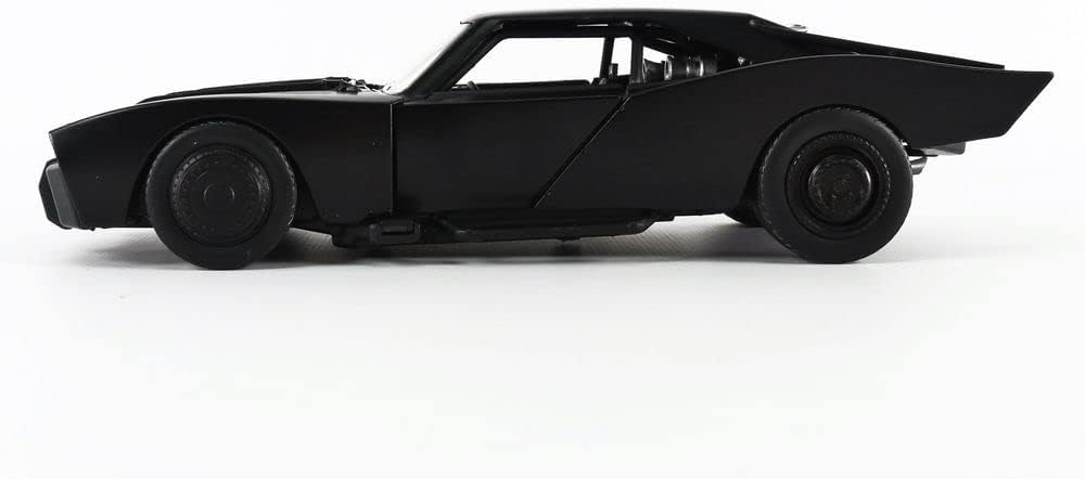 Sleek all-black muscle car model with aerodynamic design, featuring flared wheel arches and tinted windows.