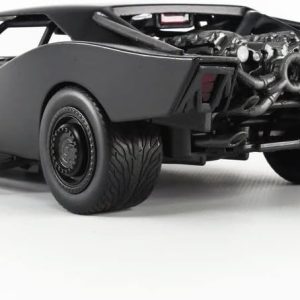Aggressive matte black model car with detailed engine, bold exhaust, and dynamic performance tires.