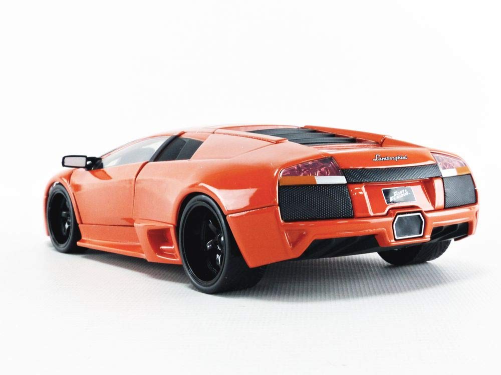 Stunning orange sports car model displays sleek design, glossy finish, and detailed features.