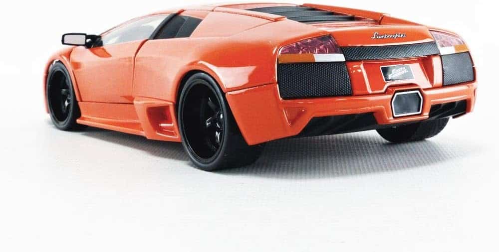 Vibrant orange sports car with black accents, showcasing luxury, performance, and aerodynamic design.