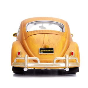 Classic yellow Volkswagen Beetle model car with chrome accents, showcasing vintage design against a white backdrop.