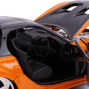 Vibrant orange sports car model with detailed black interior and luxurious design features.