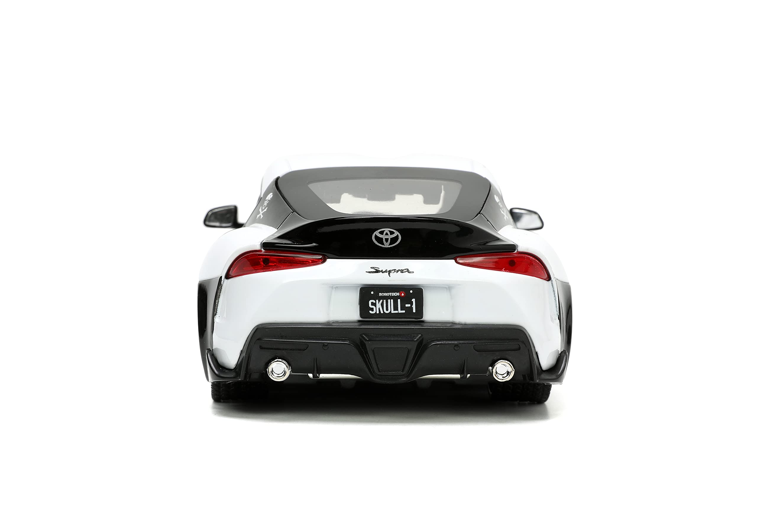 Sleek white sports car rear view highlighting performance features and aerodynamic design.