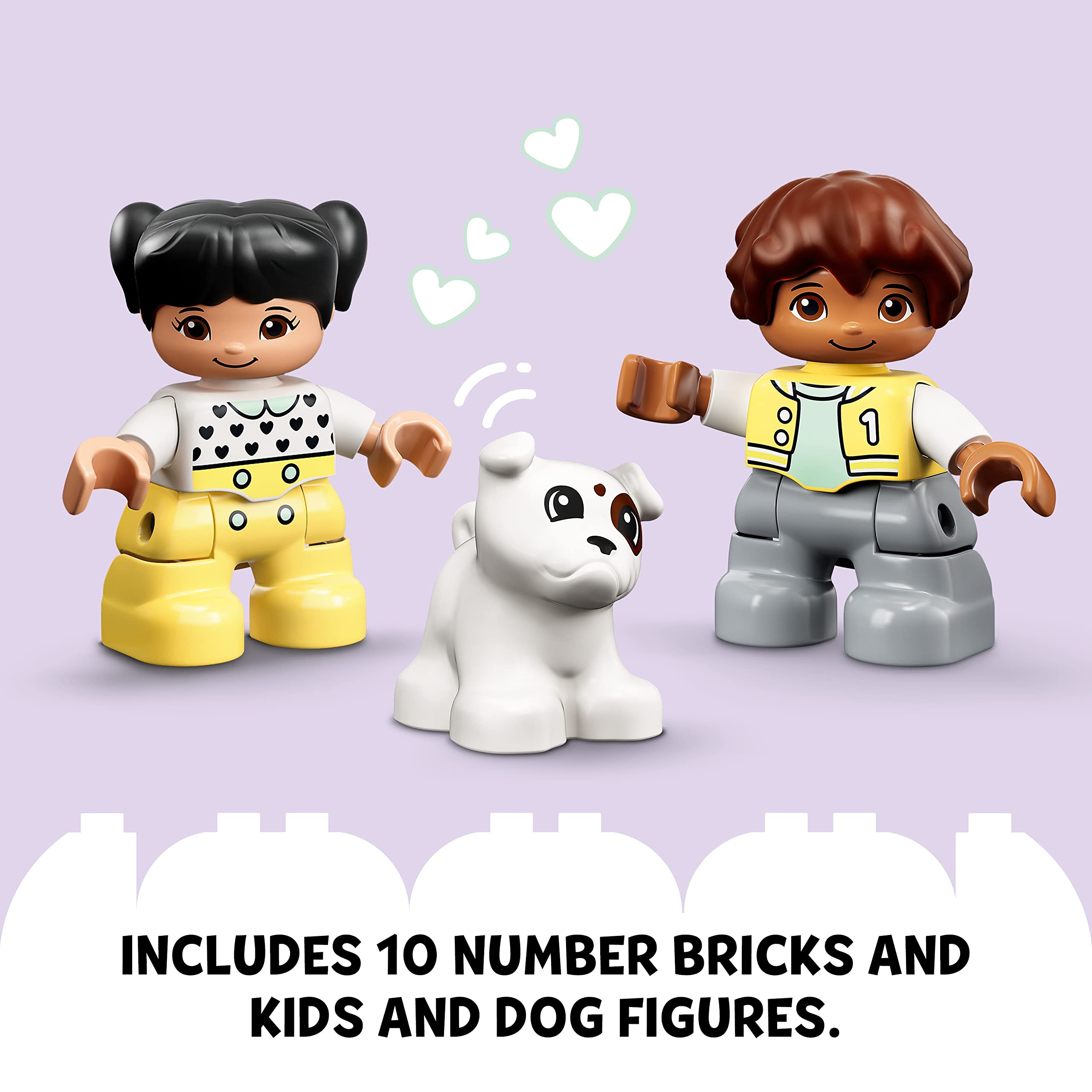 Joyful children playing with a cute dog and colorful number bricks in a cheerful scene.