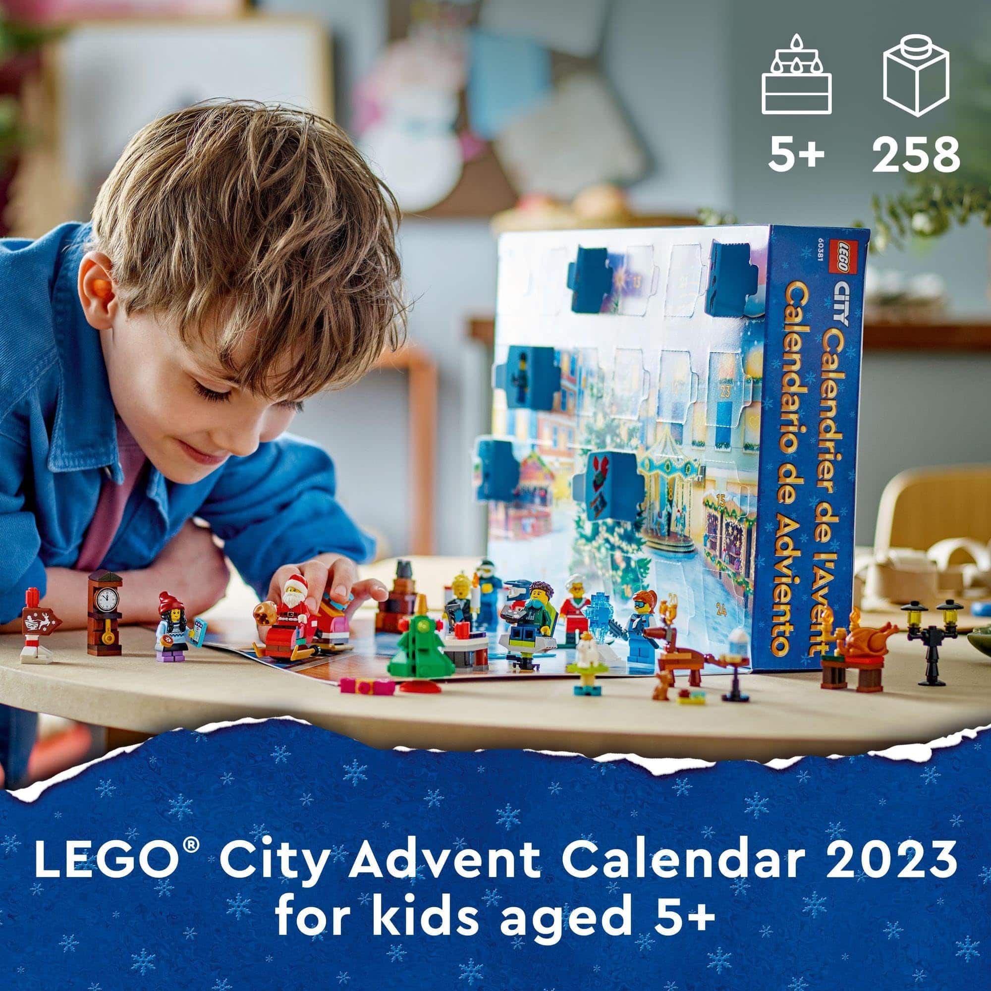 Young boy joyfully exploring LEGO City Advent Calendar 2023, perfect for festive holiday fun.
