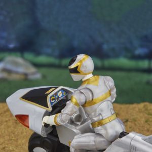 Heroic action figure on futuristic motorcycle, ready for adventure in a dynamic landscape.