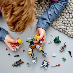 Child joyfully builds a colorful robot with blocks in a cozy play area.