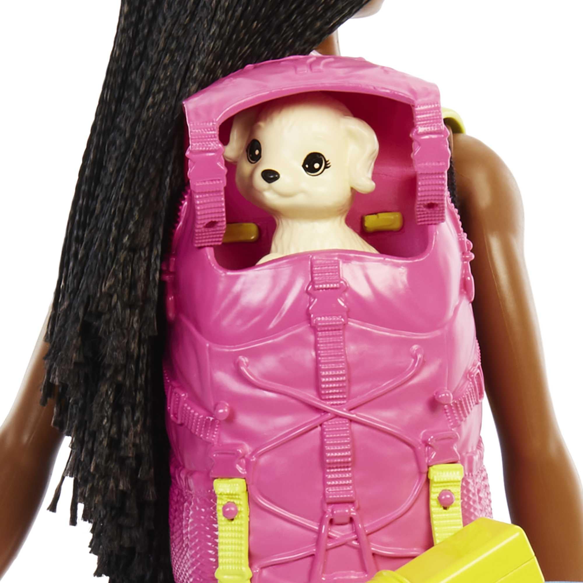 Stylish doll with a pink backpack and puppy, ready for adventurous fun and friendship.