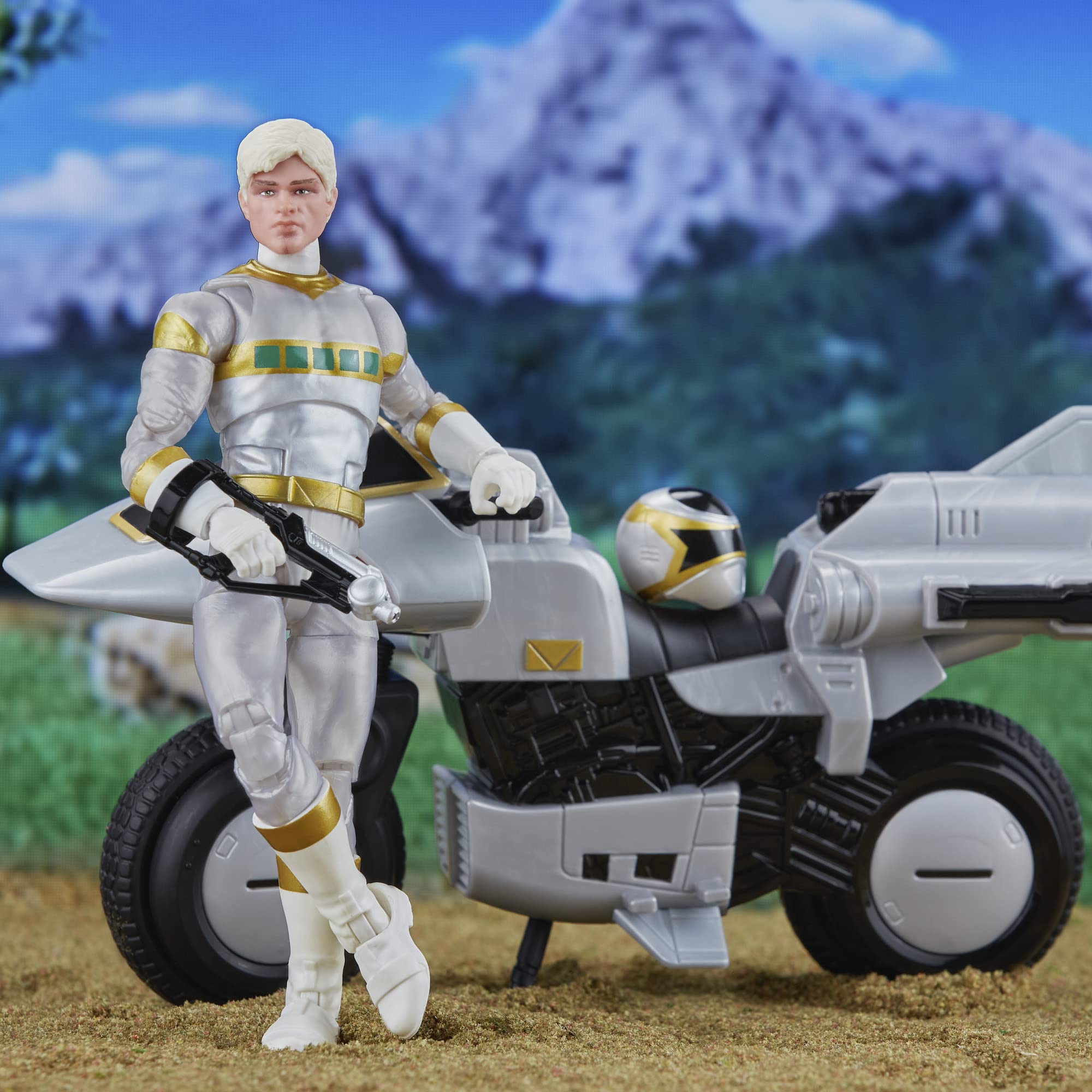 Futuristic action figure with sleek motorcycle in an adventurous mountain landscape.