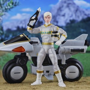 Futuristic hero action figure with sleek vehicle in a vibrant, adventurous landscape.