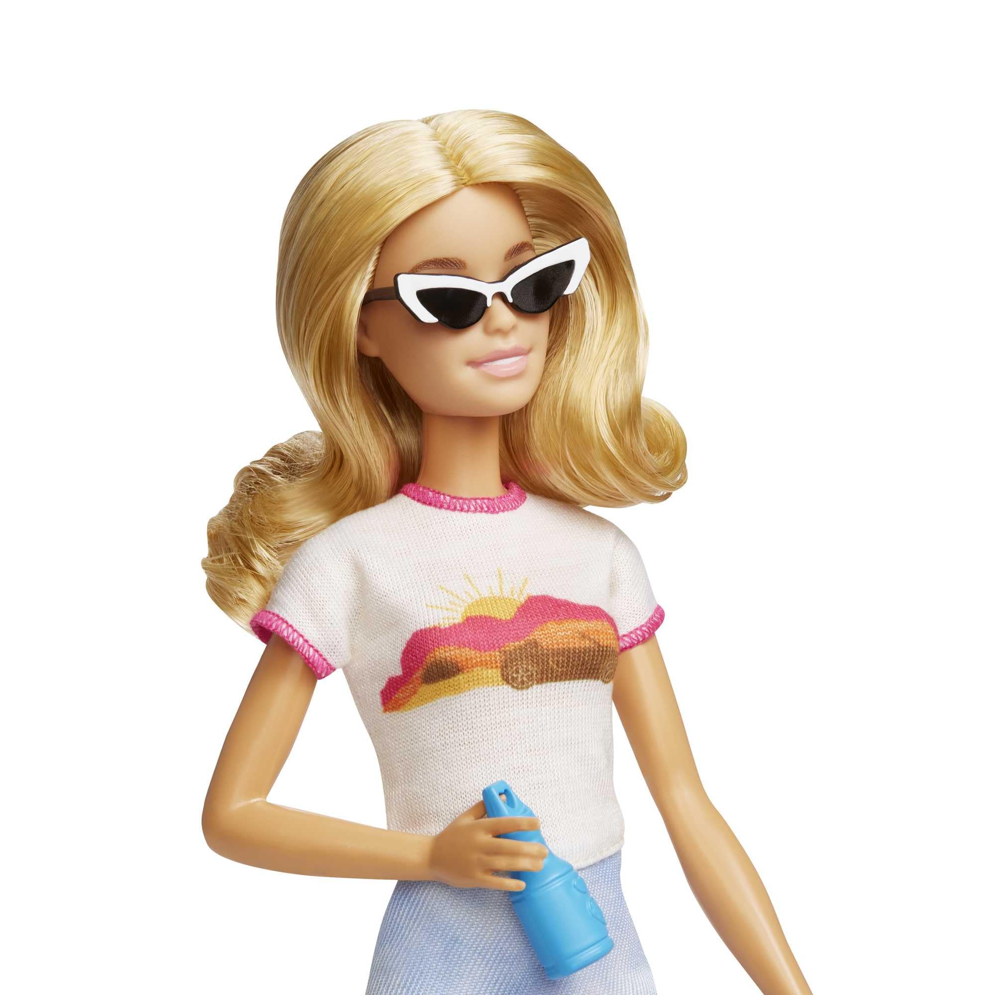 Chic summer doll with blonde waves, trendy outfit, and playful accessories for outdoor fun.