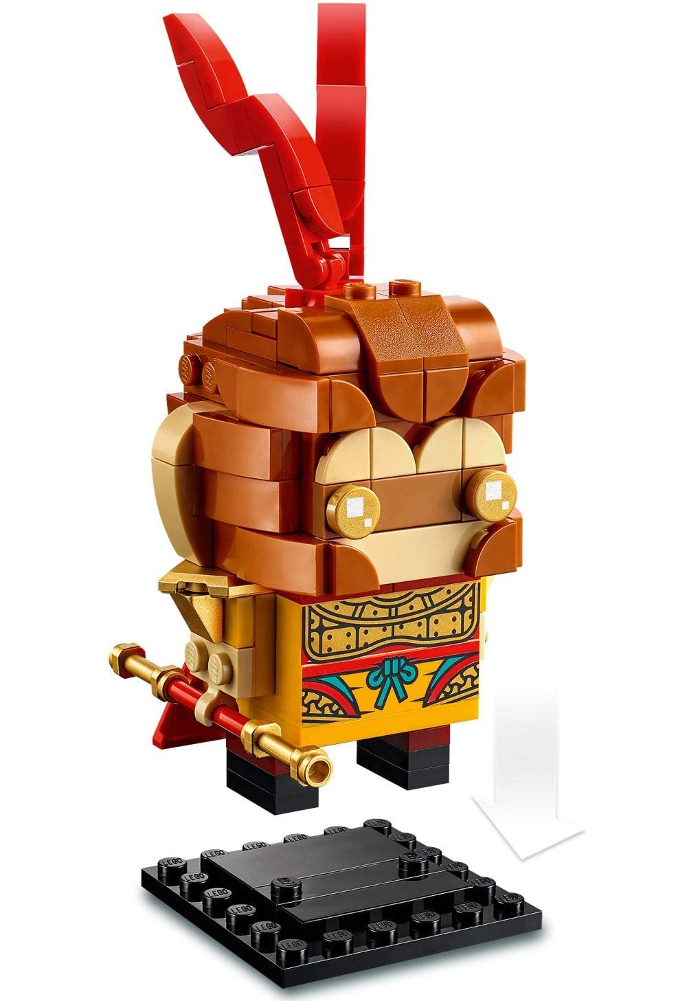 Charming LEGO character with gold accents, red ribbon, and intricate design on a black base plate.