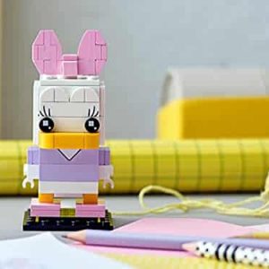 Colorful building block character with bunny ears, inspiring creativity in a playful artistic setting.
