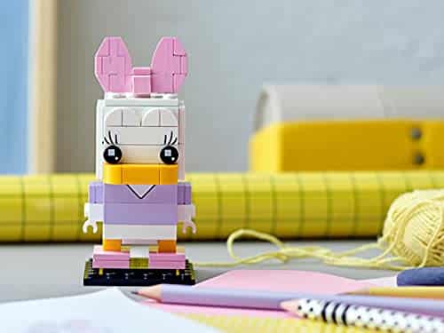 Colorful building block character with bunny ears, inspiring creativity in a playful artistic setting.
