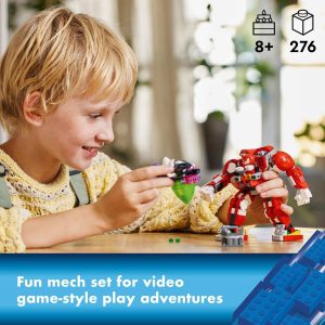 Young boy joyfully builds with a colorful mech set, sparking creativity and imaginative play.