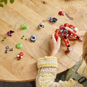 Child plays with colorful toys, sparking imagination and creativity on a cozy wooden table.