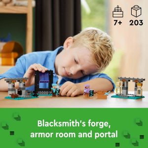 Young boy enjoys imaginative play with LEGO blacksmith forge, portal, and armor room set.