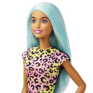Trendy pastel blue doll in bold leopard print top, showcasing style and individuality.