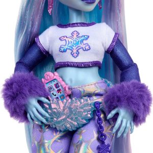 Trendy blue-skinned doll with pastel hair, snowflake top, stylish pants, and accessories.